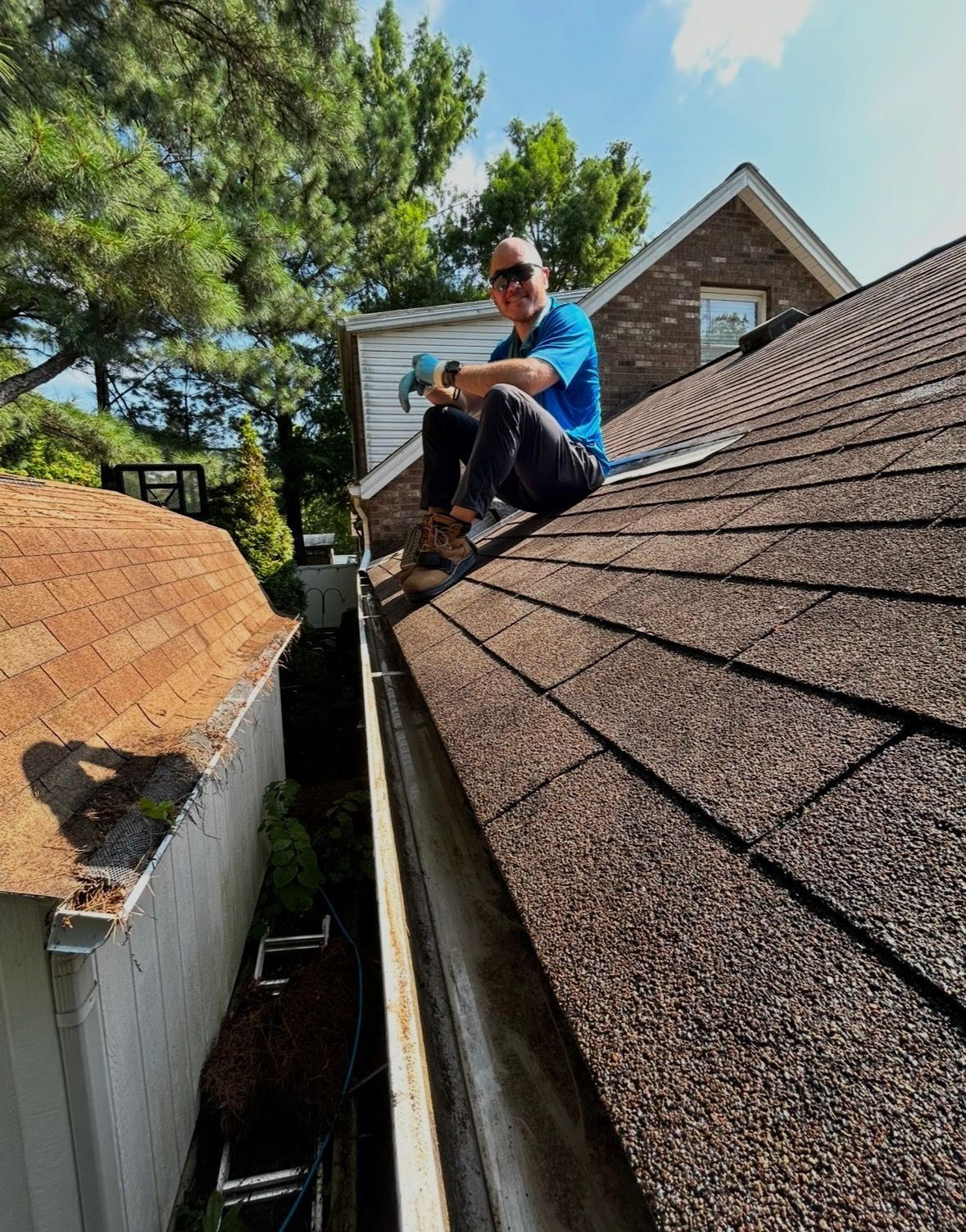 Professional gutter cleaning team from Honeydew Services LLC removing debris in Elizabethtown, KY